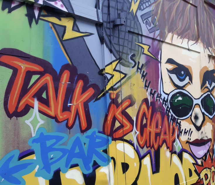 Colourful grafitti on street wall