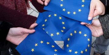 EU flags held in people's hands
