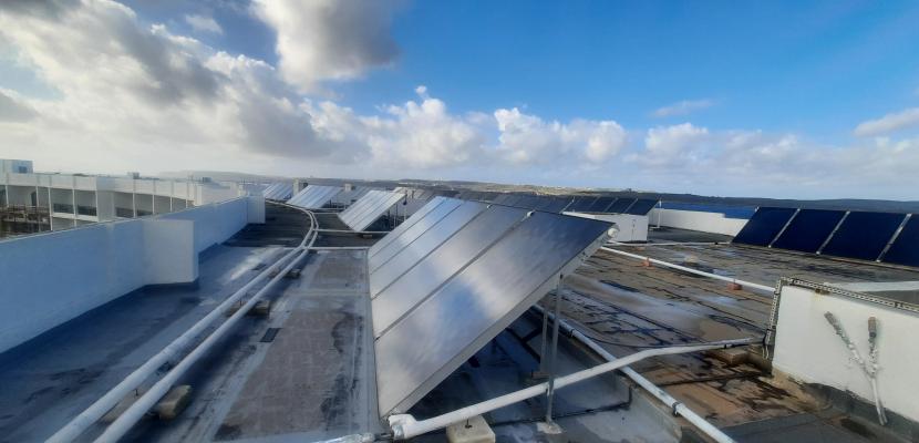 Flat plate solar collectors on roof Flat plate solar collectors on roof
