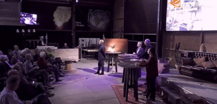 Barn Talk: The Hydrogen Transition Panelists and a moderator on stage with a public in the barn