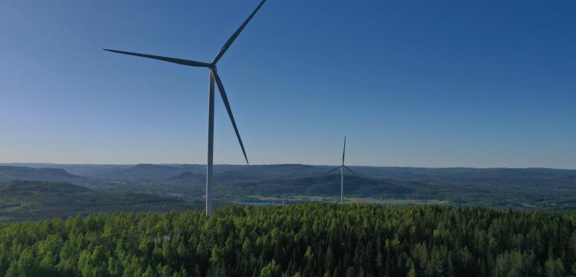 Wind mill in Ånge municipality, Mid Sweden Drone picture of a windmill in a forest landscape with blue sky