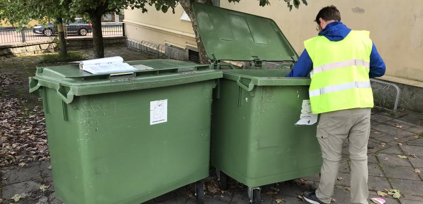 One of the environmental educators goes through the waste at one of our municipal departments