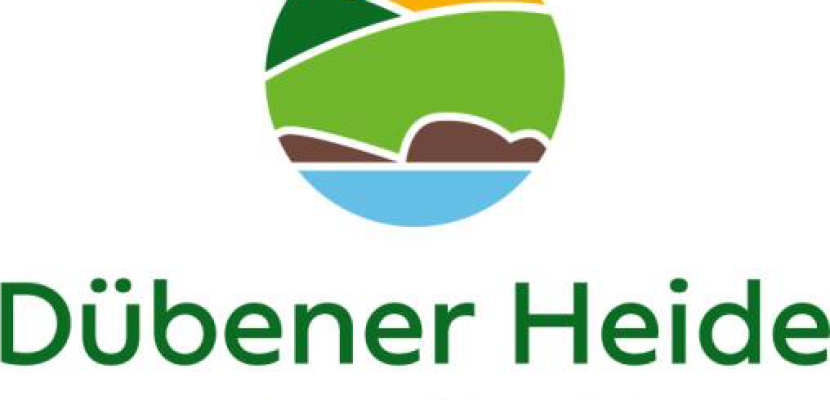 Logo Nature Park Dübener Heide A round logo with abstract hills, shrubbery and water