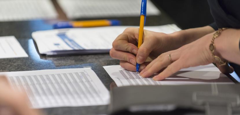 Person writing on paper