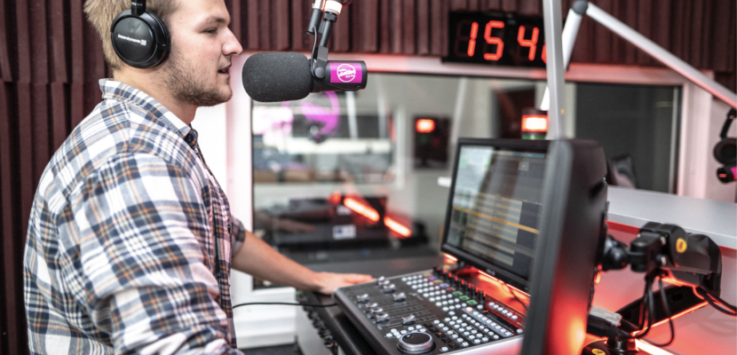 Radio Studio in the Creative Park FMK UCM A man talking to a microphone in a recording studio