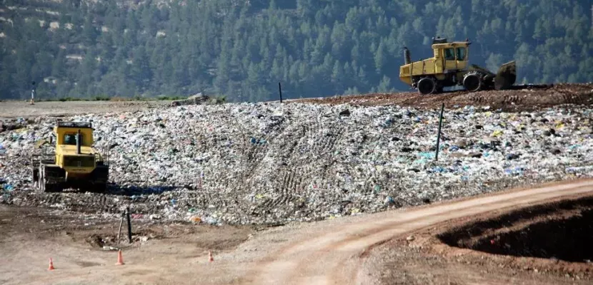 Catalonia Waste Management Plant The image shows two excavators in a waste management plant in Manresa, Catalonia.
