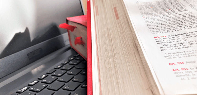 legal books and laptop legal books put on a the keyboard of a laptop