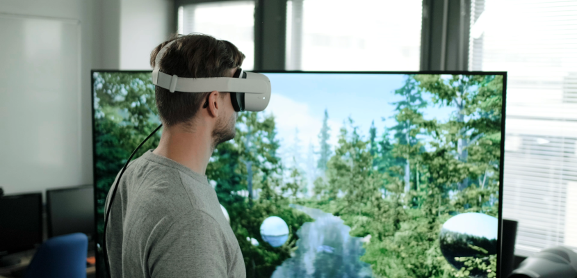 Virtual tourism in the forest Man with virtual glasses in front of a screen with a forest landscape