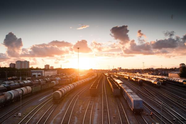 an image of trains and a sunset representing local identity in transitioning times