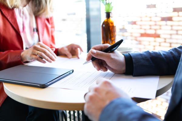 Two people discussing in a meeting