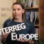 Person holding signs with words Interreg and Europe
