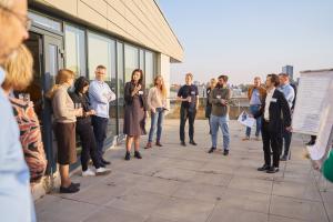 Group of people outside in a circle Group of people outside in a cirle