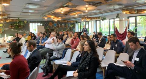 People sitting and listening to a conference