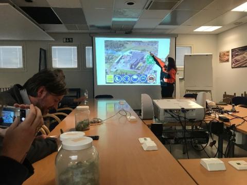 Woman giving a presentation with a white board