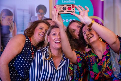Panel Event women taking selfie