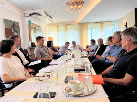 Baden bei Wien Stakeholders Meeting Group of people seated around a table on a meeting.