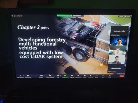 A presentation slide on developing multi-functional forestry vehicles with low-cost LiDAR systems during the "Forestry AI Webinar - Robots in Forests," attended by our FBI4EU Communication Manager, emphasizing innovations in forestry technology. A screenshot of a Zoom meeting showing a presentation slide titled "Chapter 2 (RO2) Developing forestry multi-functional vehicles equipped with low cost LiDAR system." The slide includes an image of a vehicle equipped with technology. The participant panel on the right shows attendees including Agnieszka Nedza, Walter Yen, Heesung Woo, Matías Mattamala, and Philippe Giguère.