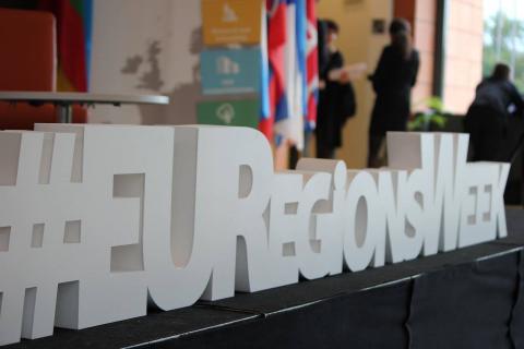 #EURegionsWeek woodblock on a table 