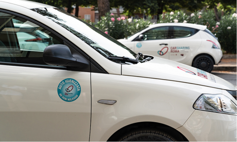 car-sharing car in Rome with the sticker highlighting the sanitation service inside the vehicle
