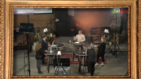People standing in a circle and debating