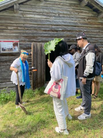 Blacksmiths shop at Old Kurimo Suomussalmi Tour group visiting blacksmith house