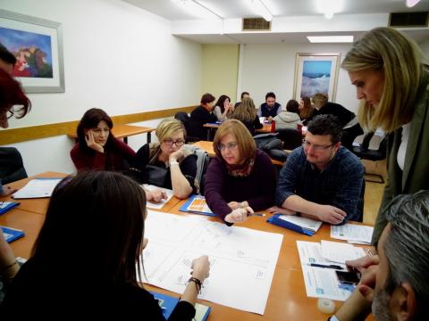 Previous co-creation workshop hosted by CERTH A group of people around a table engage in an collaborative exercise