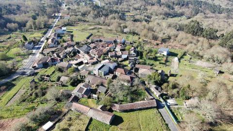 Aerial view of the entire Model Village, with the buildings and the adjacent area intended for pig production