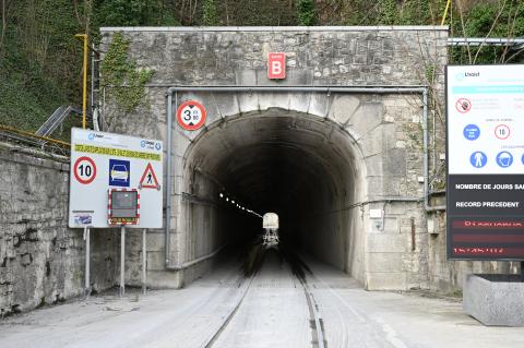 there is\ are a tunnel, signals, road signs and binaries