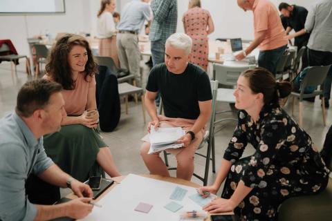 People speaking around a table People speaking around a table