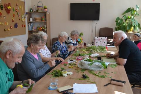 Members of the cooperative jointly prepare artistic products.