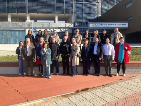 project partners people in front of a building