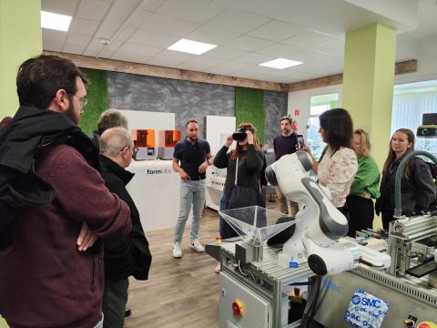 3F partners visit PBN offices. People demoing VR headset.