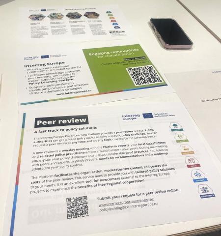Interreg Europe brochures on table at European Climate Pact event 2025 Interreg Europe brochures on table at European Climate Pact event