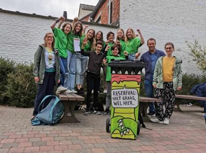 older pupils recieving award for their composting efforts