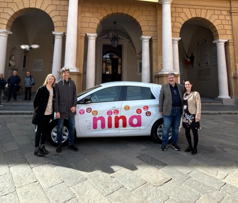 NINA Car sharing NINA car sharing vehicle, in front of the entrance to the Municipality of Reggio Emilia, with the promoters of the initiative of the Municipality of Reggio Emilia