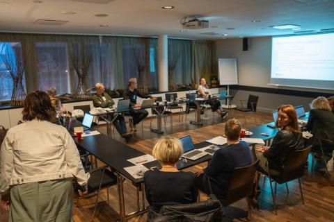 Third study visit to Finland People sitting in a conference room watching a presentation