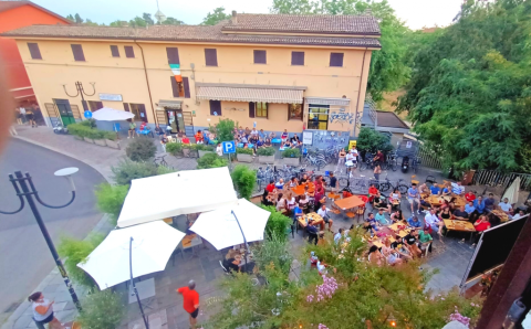 Group of people meeting in Neighbourhood House Gattaglio, in the outdoor space. View from above