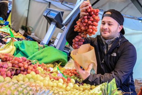 Regional fruit from the weekly market A man sells regional fruit.