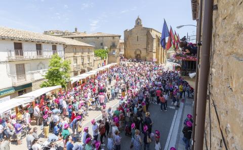 Group of people in the village square at a festivity