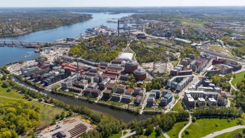 Study visits during Europe, let's cooperate! on 15 March 2023 will take you to interesting sites around Stockholm Aerial view of a seaside urban development area (buildings, river, green areas)