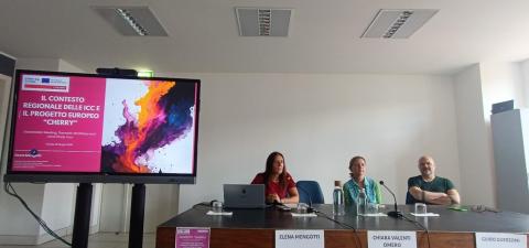 Cherry Stakeholder meeting in Trieste 3 people at presentation table indoors