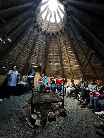 The evening activity took place in a traditional hut, where everyone told stories of their home region in Europe. Evening activity in a traditional hut, Rovaniemi, Lapland.