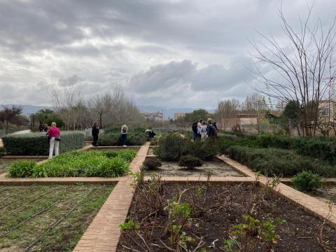 Murcia Rio Project visit Murcia Rio Project sight of different parts of vegetation areas. People are walking through the garden on narrow paved paths. The background is a beautifully grey clouded sky