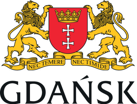 The image shows the coat of arms of Gdańsk, a city in Poland. It features a red shield with a gold crown on top, and two white crosses (specifically the Maltese crosses) positioned vertically in the center of the shield. The shield is flanked by two gold lions, each standing on its hind legs. Below the shield is a ribbon banner with the Latin motto "NEC TEMERE NEC TIMIDE," which translates to "Neither rashly nor timidly." Below the banner, the word "GDAŃSK" is written in bold, capital letters.