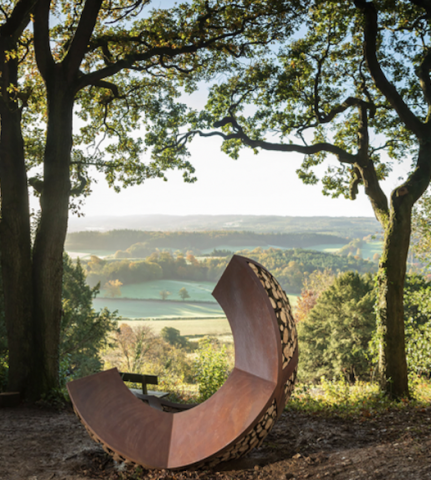 Wooden artwork on hill