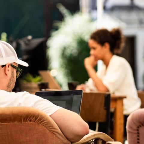 man and woman working in a coworking space