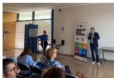 Hauts de France stakeholders learn about the benefits of cohesion projects Man speaking to group of stakeholders