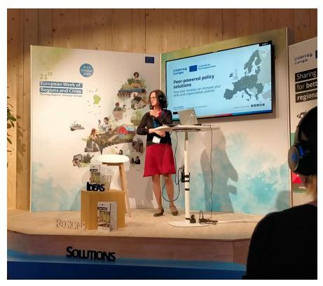 The Policy Learning Platform's preentation A speaker on a stage