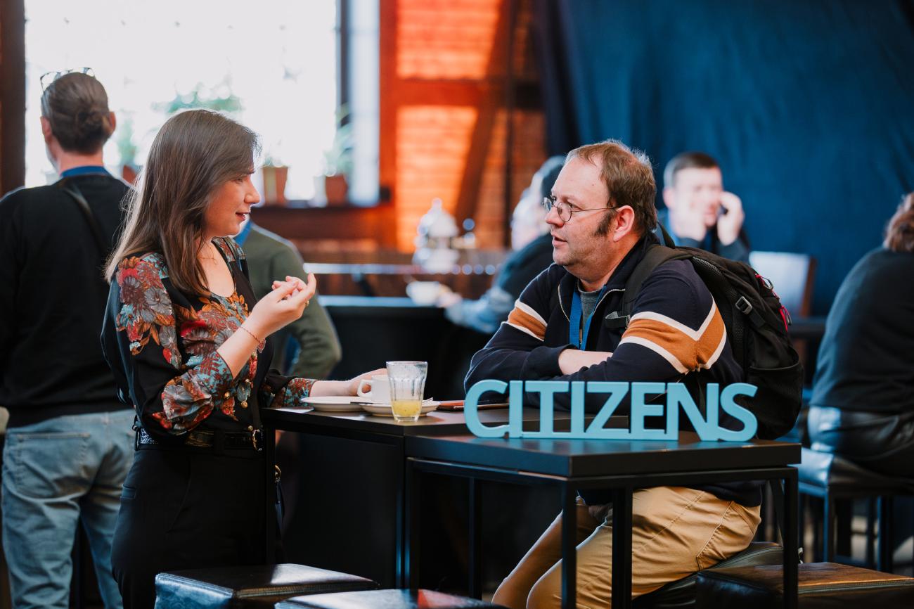 Two people discuss about citizens topics at Europe, let's cooperate 2025 in Krakow