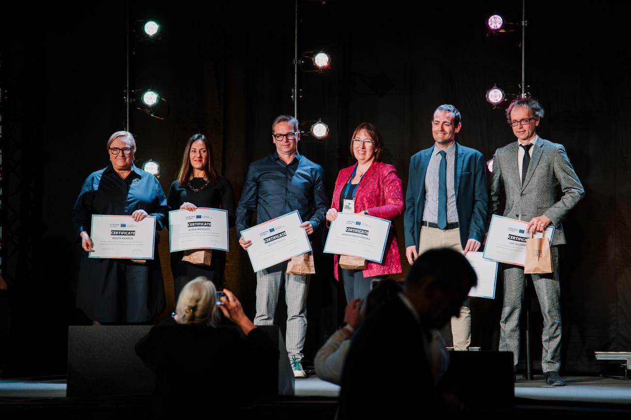 Six people receive certificates on stage at Europe, let's cooperate! 2025